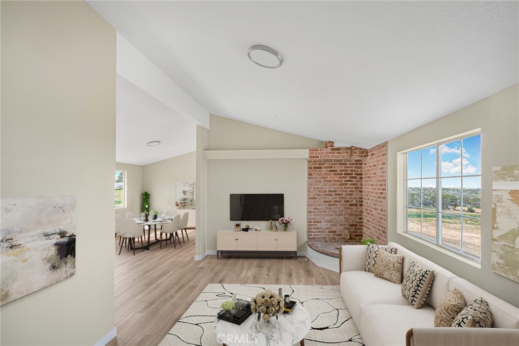 7773 Sequoia Road Phelan, CA 92371 - Photo 2 of 32 a living room with furniture and a flat screen tv