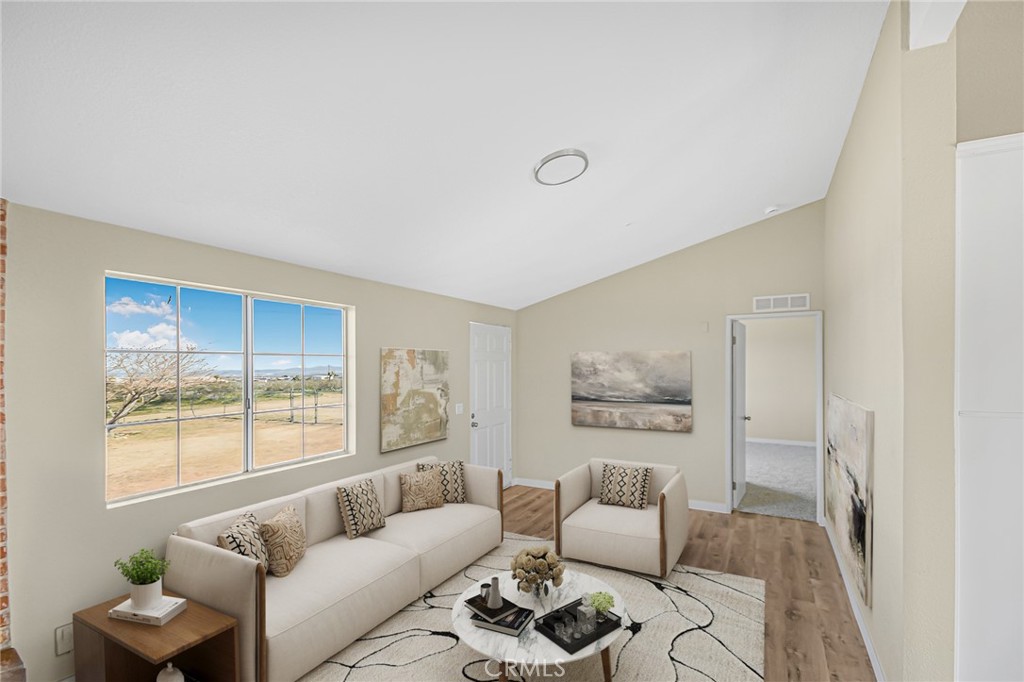 7773 Sequoia Road Phelan, CA 92371 - Photo 5 of 32 a living room with furniture and a large window