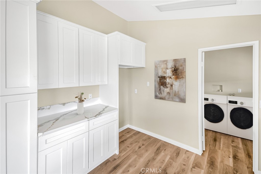 7773 Sequoia Road Phelan, CA 92371 - Photo 8 of 32 a kitchen with a white cabinets a sink and dishwasher