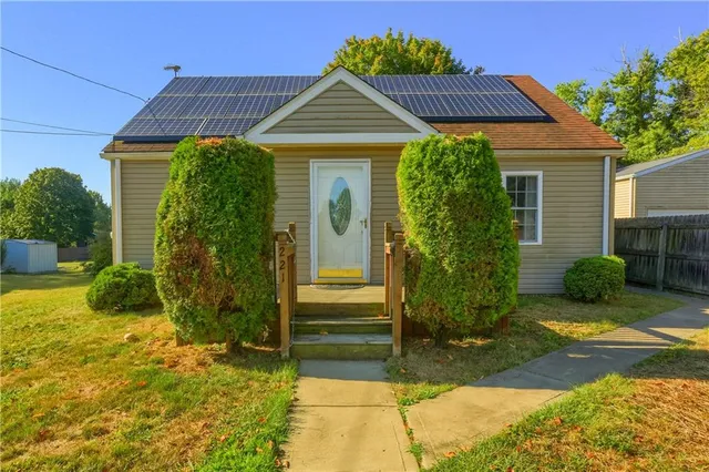 a front view of a house with garden