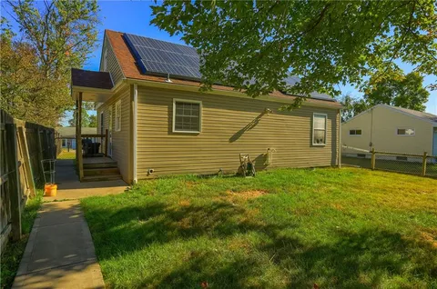 a backyard of a house with lots of green space