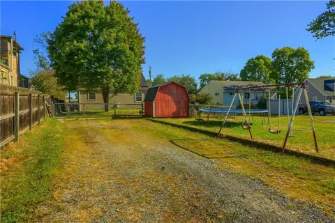 a view of a swimming pool with a yard