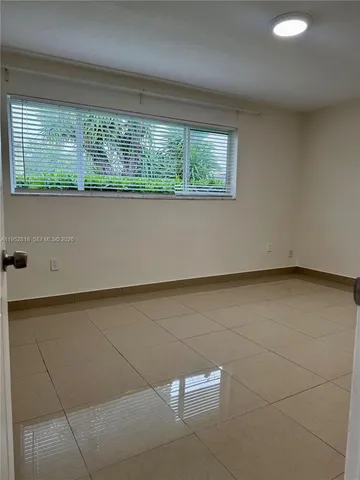 a view of a room with a large window