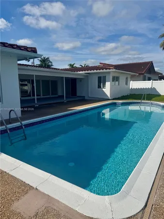 a front view of a house with swimming pool