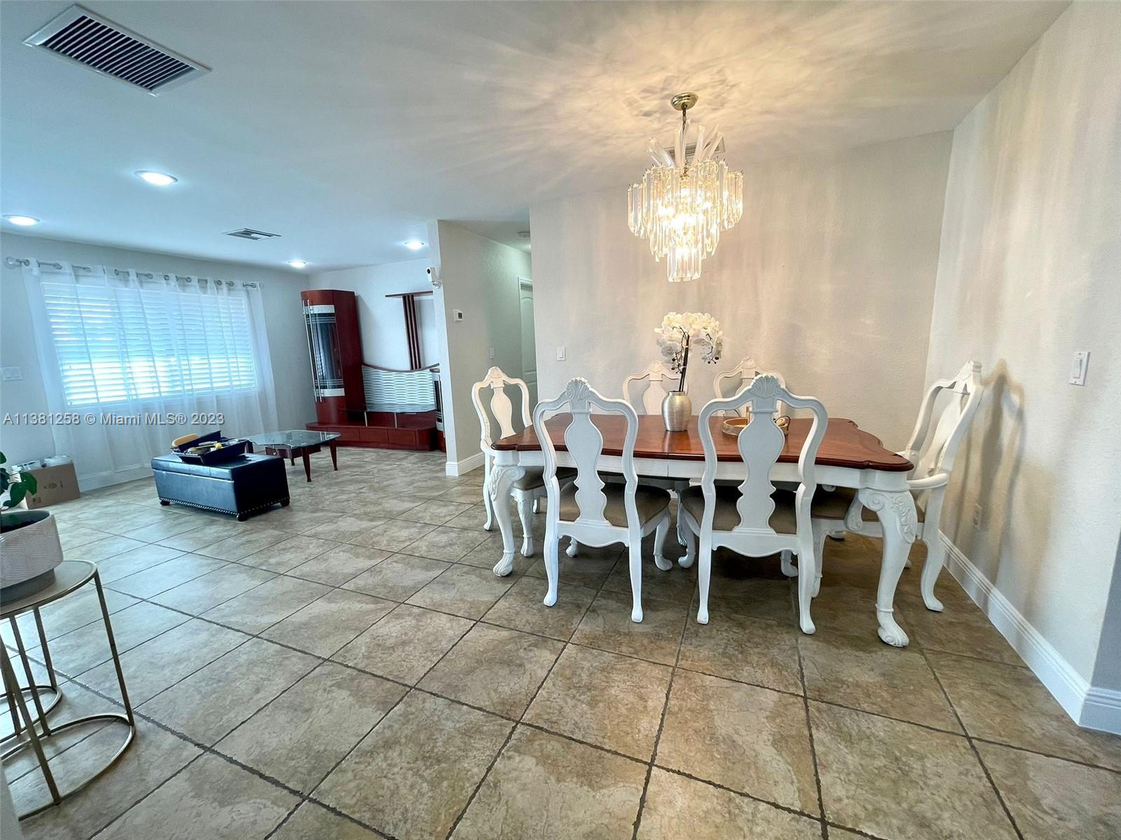 25305 Southwest 124th Court Homestead, FL 33032 - Photo 12 of 39 a view of a dining room with furniture