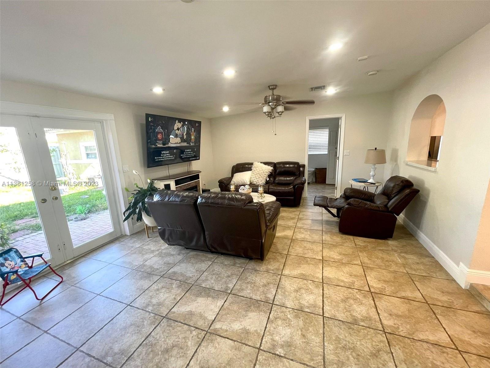 25305 Southwest 124th Court Homestead, FL 33032 - Photo 18 of 39 a living room with furniture and a flat screen tv