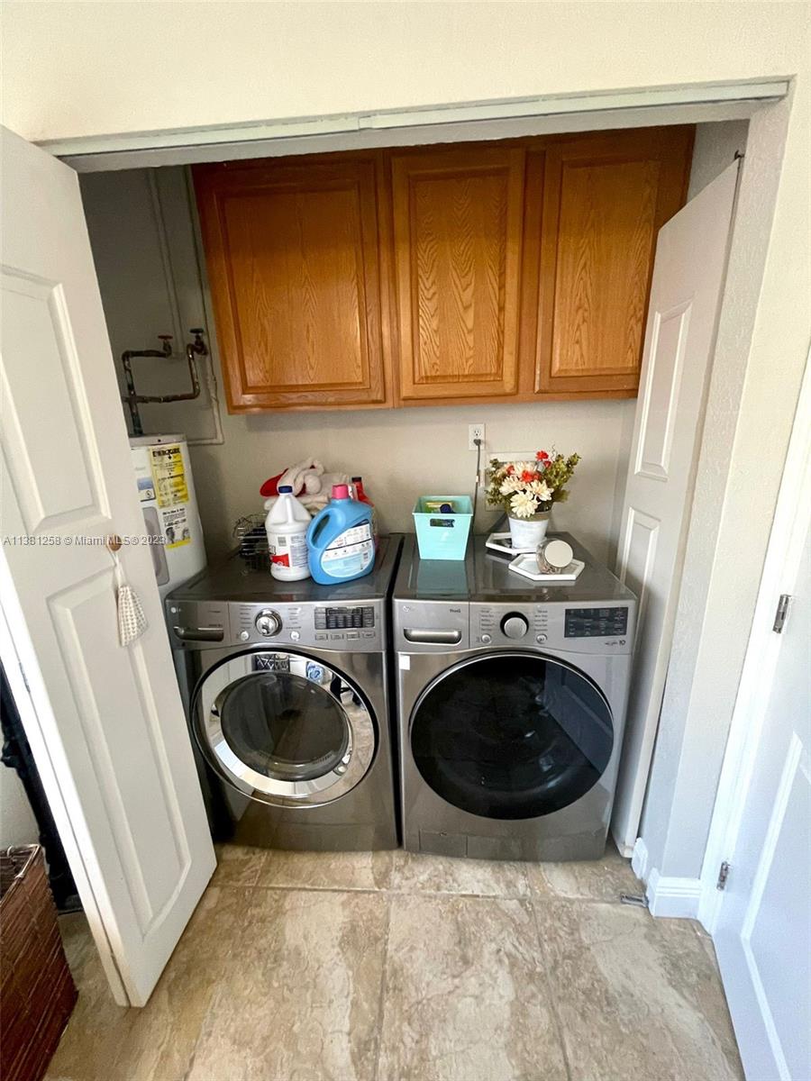 25305 Southwest 124th Court Homestead, FL 33032 - Photo 20 of 39 a utility room with sink dryer and washer