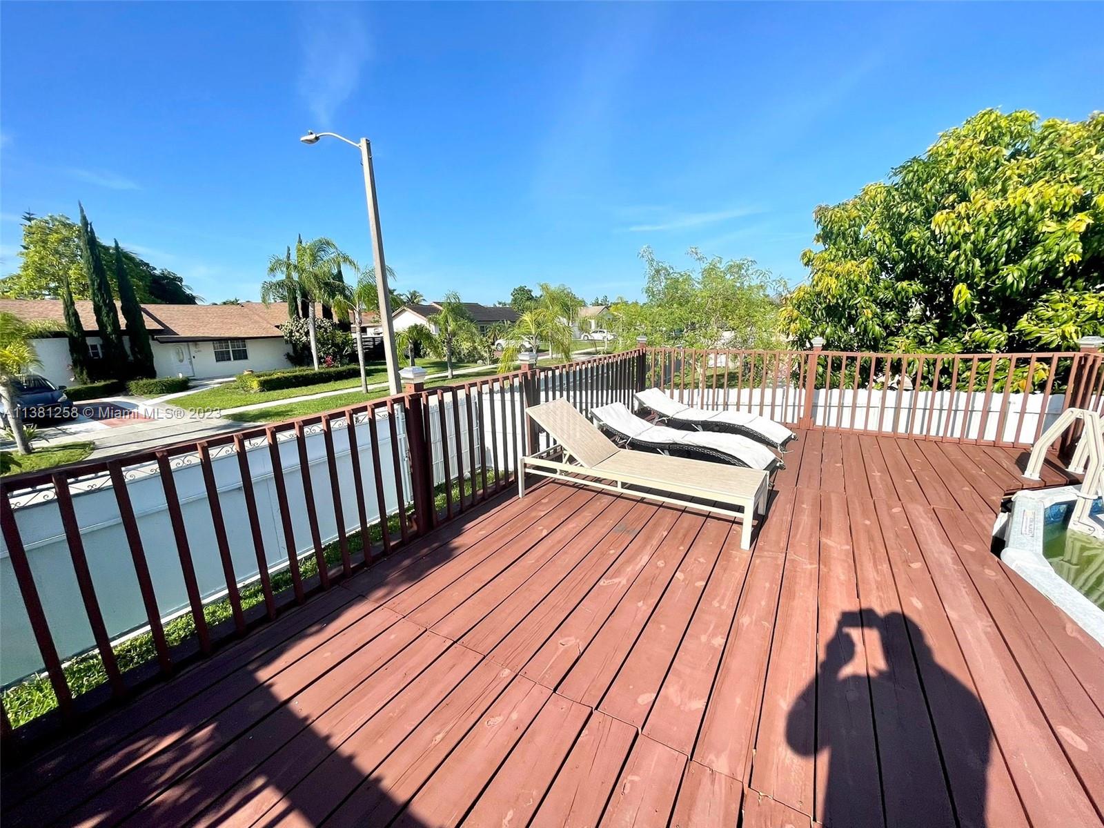 25305 Southwest 124th Court Homestead, FL 33032 - Photo 34 of 39 a view of balcony with wooden floor and outdoor space