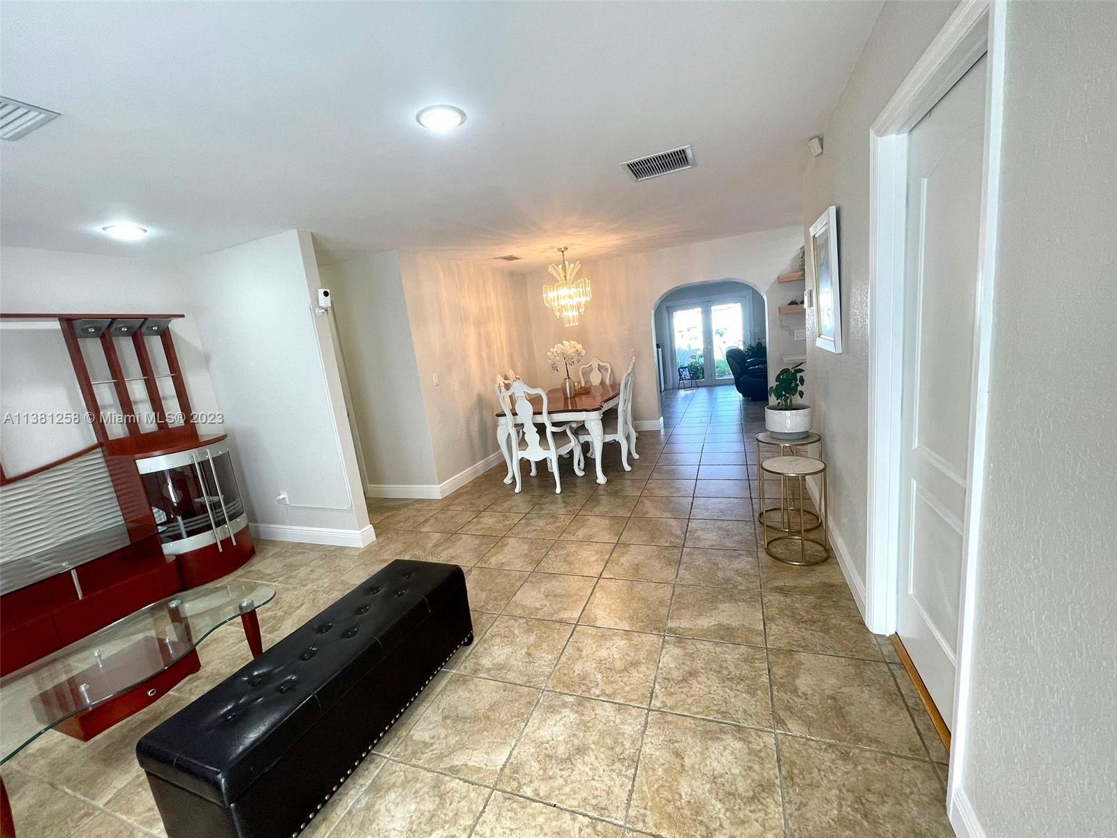25305 Southwest 124th Court Homestead, FL 33032 - Photo 10 of 39 a view of a livingroom with furniture and a mirror
