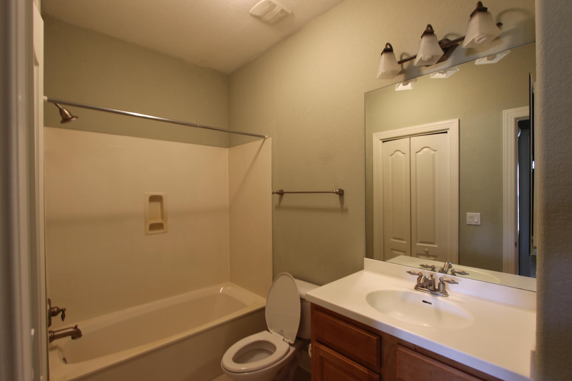 263 Diamond Cove, Unit 263 Destin, FL 32541 - Photo 8 of 11 a bathroom with a sink a mirror a bathtub and shower