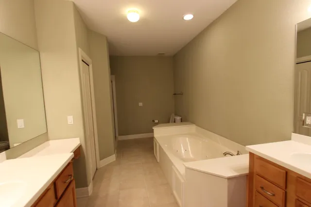 a bathroom with a sink a toilet and vanity