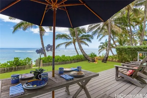 a view of a backyard with sitting area