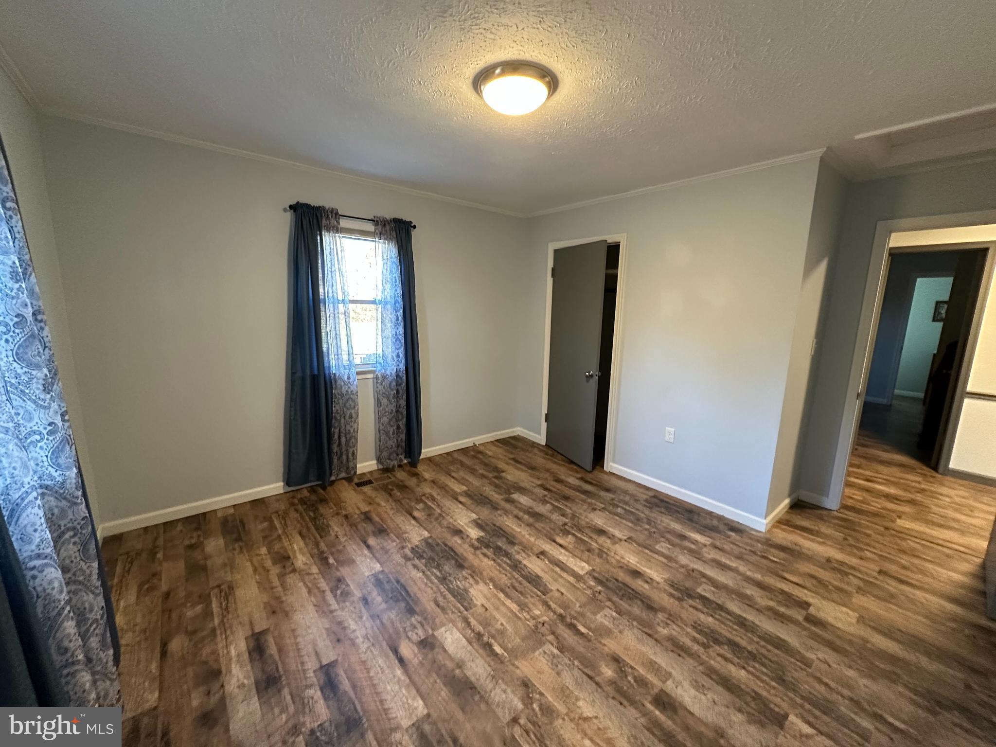 650 Honeyville Road Stanley, VA 22851 - Photo 19 of 27 a view of empty room with wooden floor