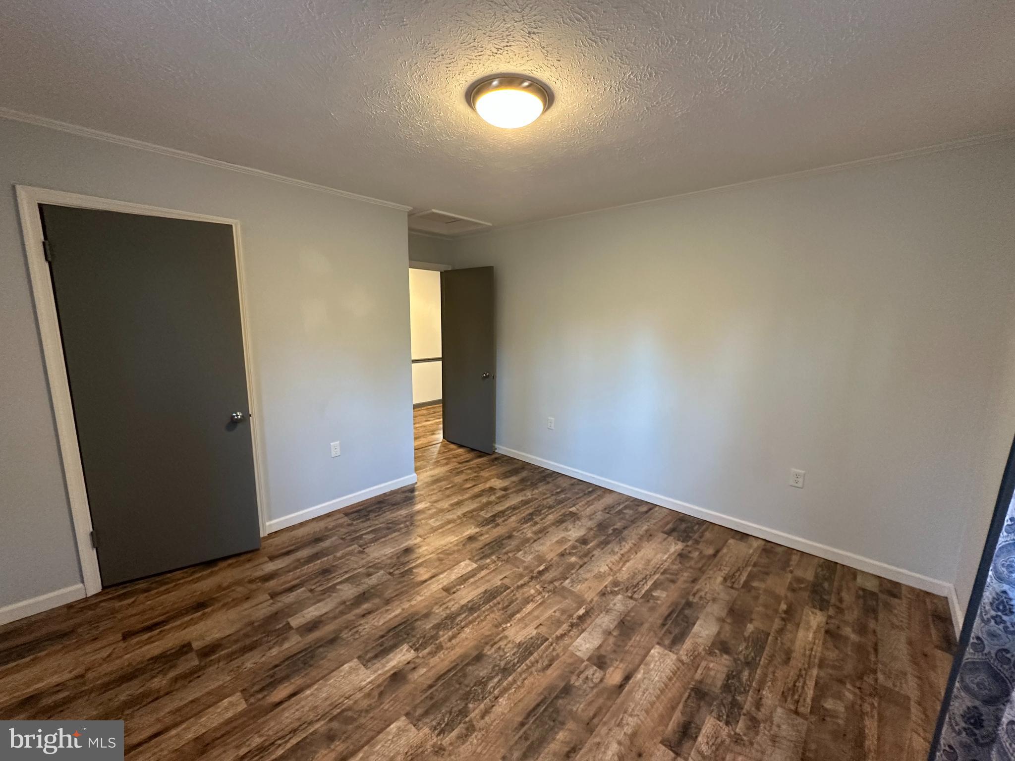 650 Honeyville Road Stanley, VA 22851 - Photo 20 of 27 wooden floor in an empty room with a window