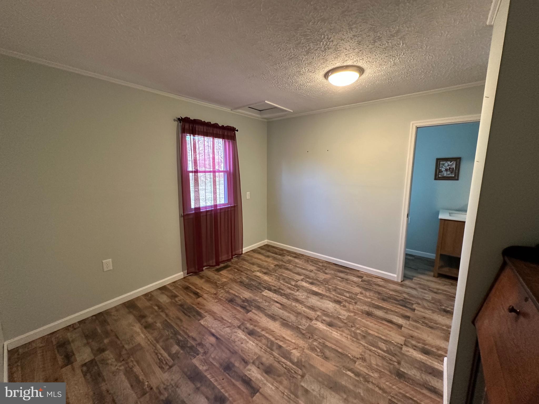 650 Honeyville Road Stanley, VA 22851 - Photo 22 of 27 a view of an empty room and window