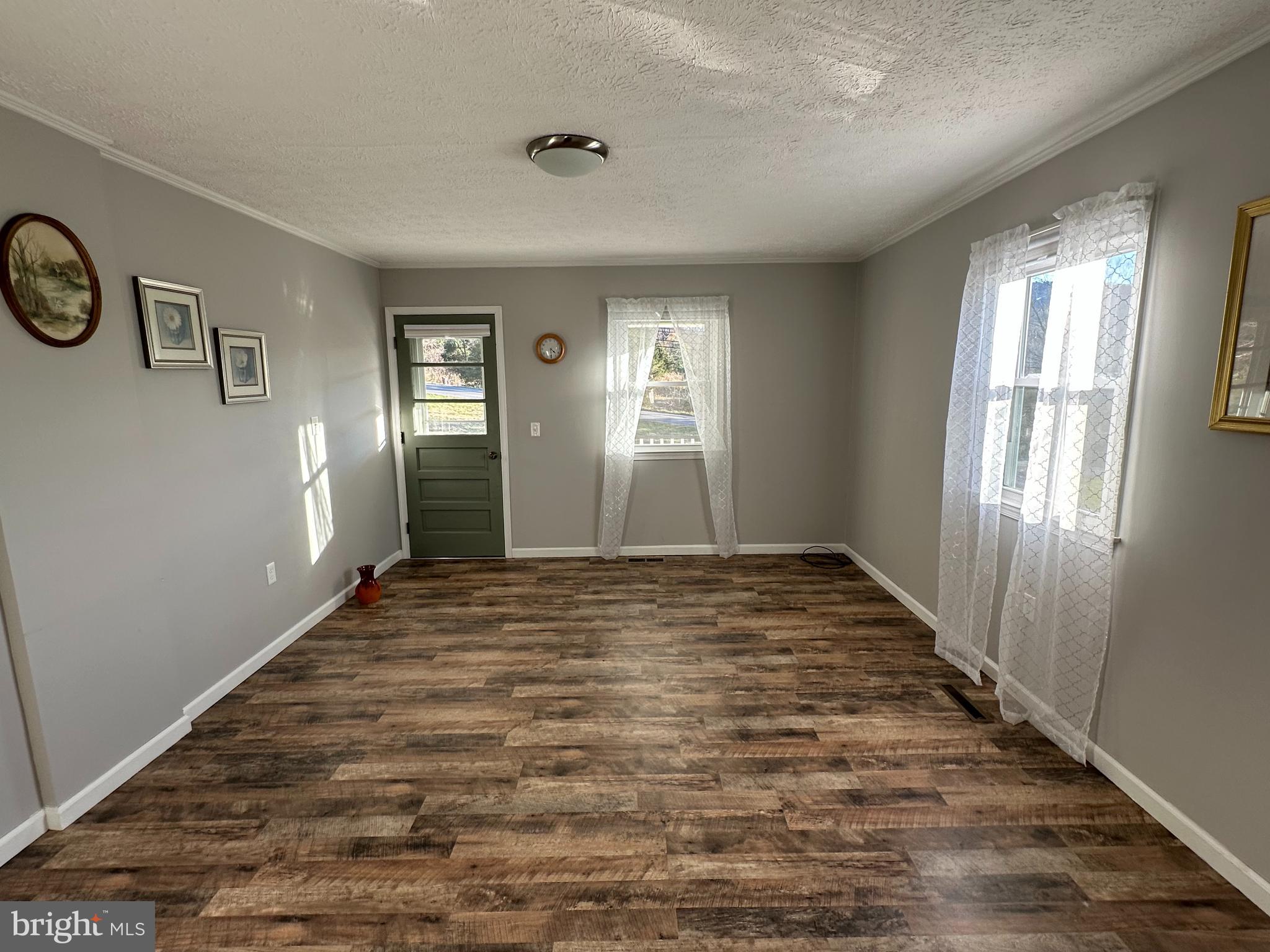 650 Honeyville Road Stanley, VA 22851 - Photo 9 of 27 wooden floor in an empty room with a window