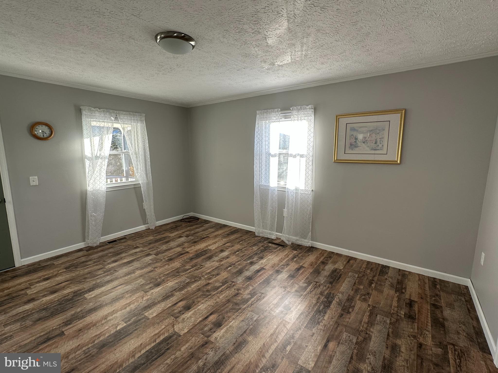 650 Honeyville Road Stanley, VA 22851 - Photo 10 of 27 a view of empty room with wooden floor and fan