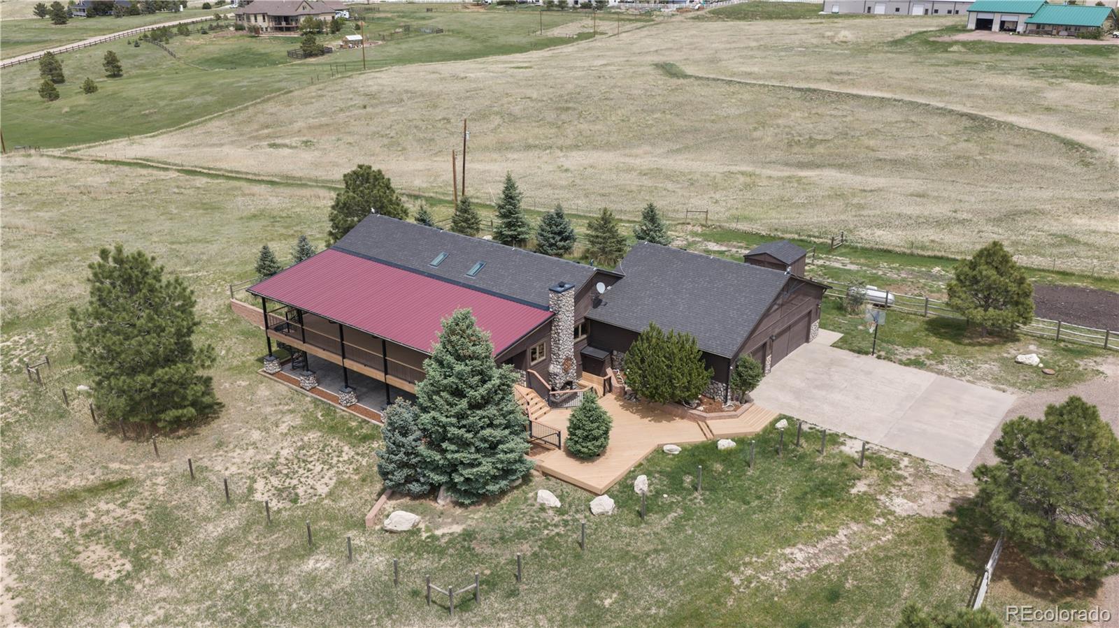 74 Rocky Cliff Road Elizabeth, CO 80107 - Photo 3 of 50 an aerial view of a house with a yard