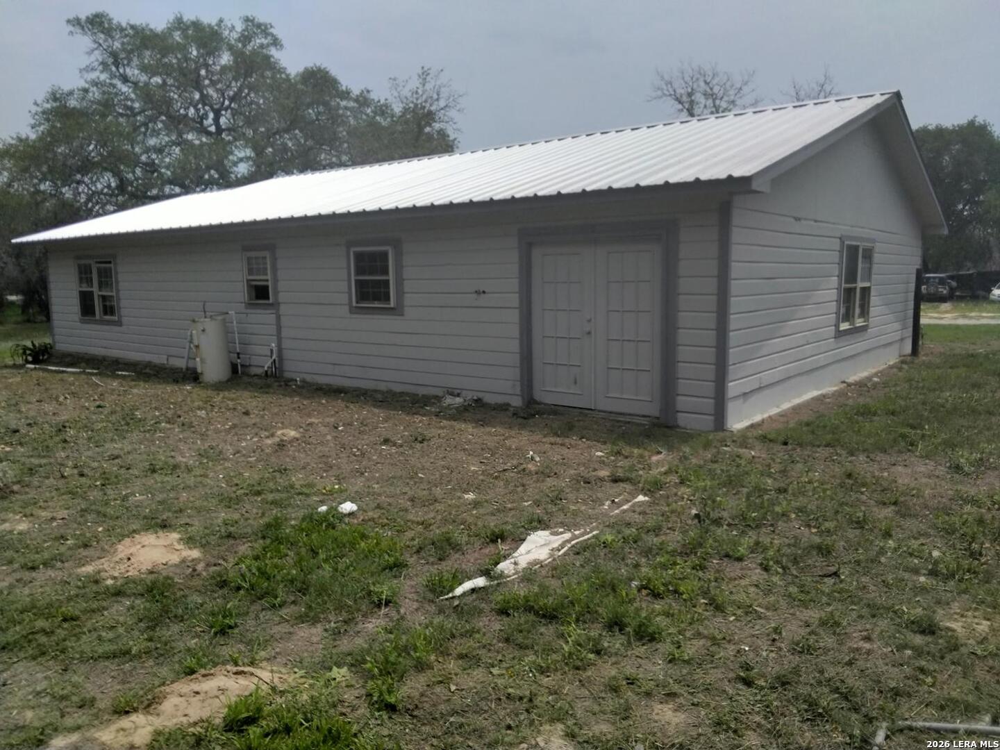 82 Lance Lane Poteet, TX 78065 - Photo 5 of 5 a backyard of a house