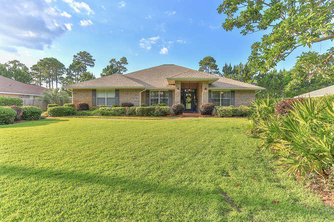224 Shipwreck Road Santa Rosa Beach, FL 32459 - Photo 1 of 38 a front view of house with yard and green space