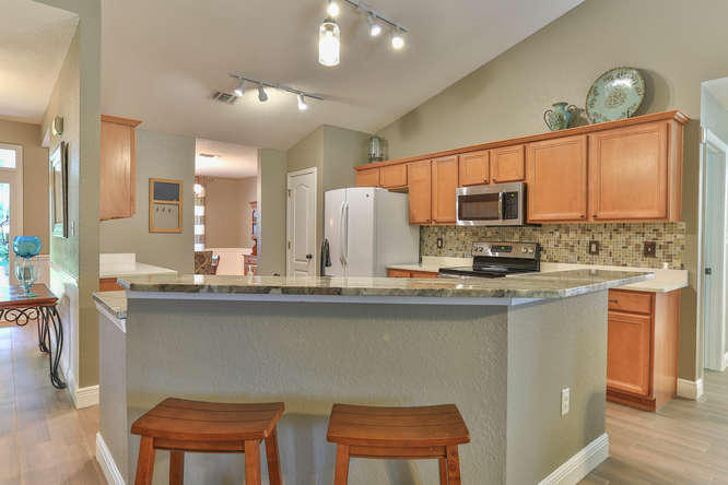 224 Shipwreck Road Santa Rosa Beach, FL 32459 - Photo 11 of 38 a kitchen with stainless steel appliances a sink stove and cabinets