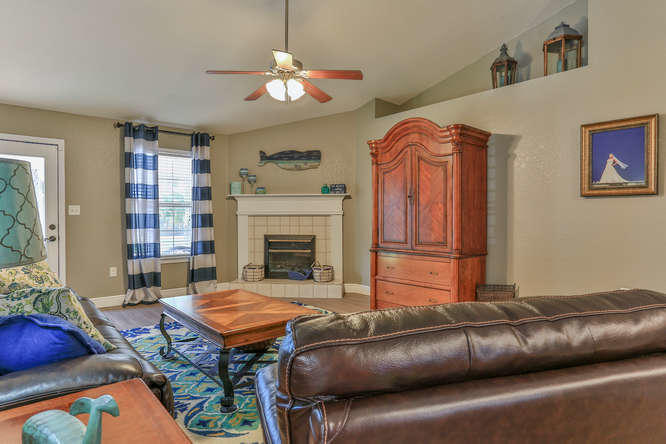 224 Shipwreck Road Santa Rosa Beach, FL 32459 - Photo 13 of 38 a living room with furniture and a fireplace