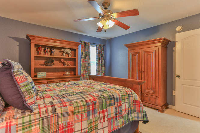 224 Shipwreck Road Santa Rosa Beach, FL 32459 - Photo 19 of 38 a bedroom with a bed and a chandelier
