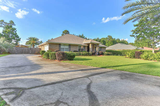 224 Shipwreck Road Santa Rosa Beach, FL 32459 - Photo 2 of 38 a view of a house with a big yard and large trees