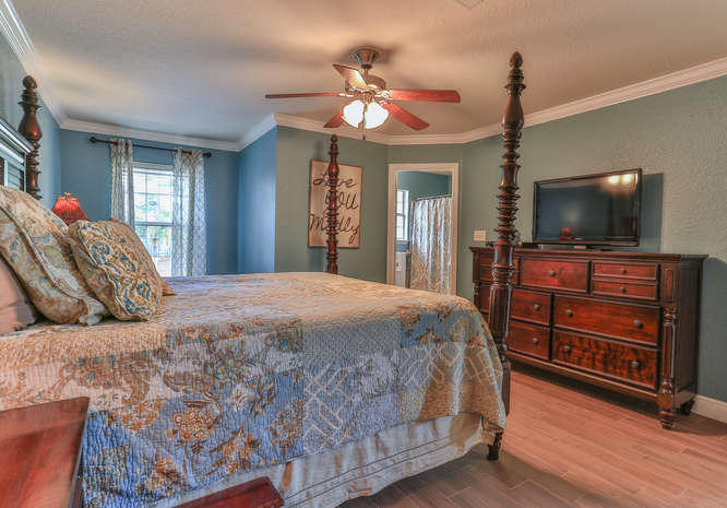 224 Shipwreck Road Santa Rosa Beach, FL 32459 - Photo 21 of 38 a bedroom with a bed and a flat screen tv