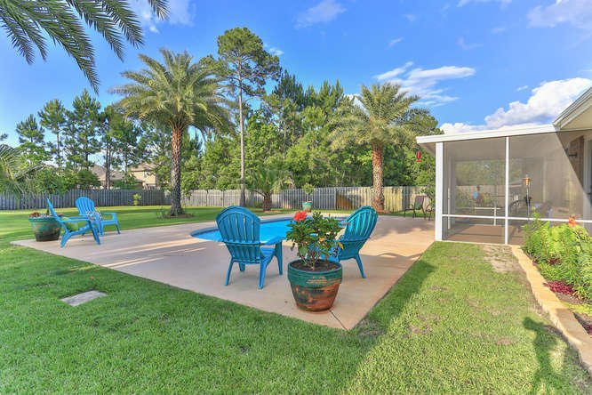 224 Shipwreck Road Santa Rosa Beach, FL 32459 - Photo 30 of 38 a view of a backyard with sitting area and slide