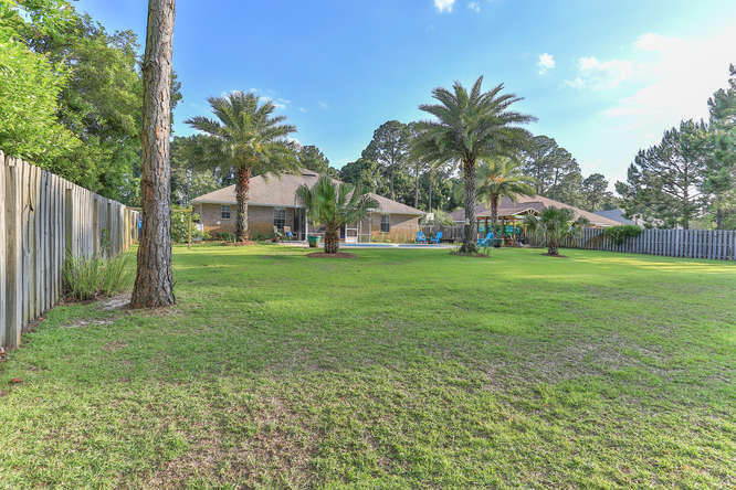 224 Shipwreck Road Santa Rosa Beach, FL 32459 - Photo 36 of 38 a view of a house with a yard and garage