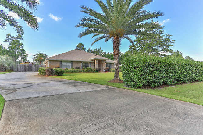 224 Shipwreck Road Santa Rosa Beach, FL 32459 - Photo 38 of 38 a front view of house with yard and green space