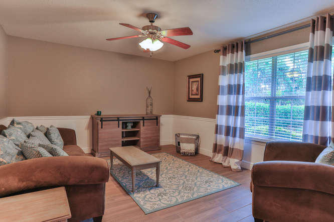 224 Shipwreck Road Santa Rosa Beach, FL 32459 - Photo 5 of 38 a living room with furniture and a large window