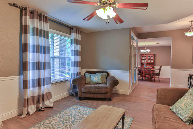 224 Shipwreck Road Santa Rosa Beach, FL 32459 - Photo 6 of 38 a living room with furniture and a chandelier