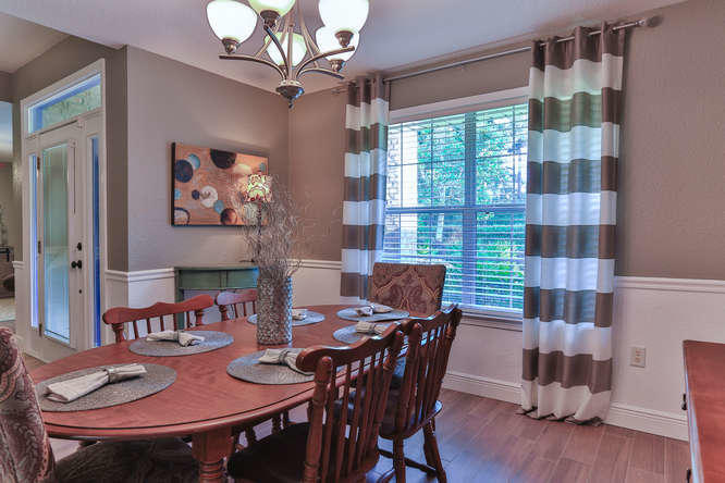 224 Shipwreck Road Santa Rosa Beach, FL 32459 - Photo 8 of 38 a view of a dining room with furniture window and wooden floor