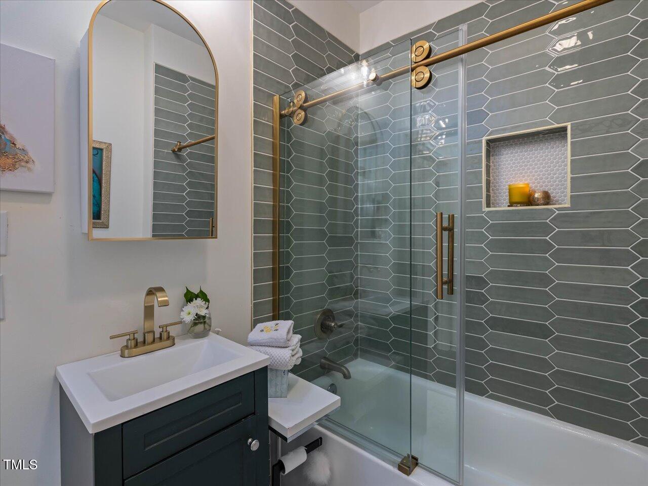 611 Dunbar Street Durham, NC 27701 - Photo 16 of 28 a bathroom with a sink a toilet and shower