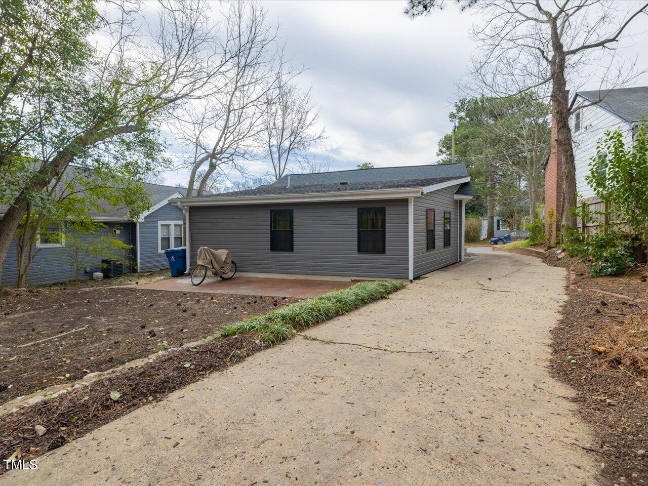611 Dunbar Street Durham, NC 27701 - Photo 20 of 28 a front view of a house with yard and trees