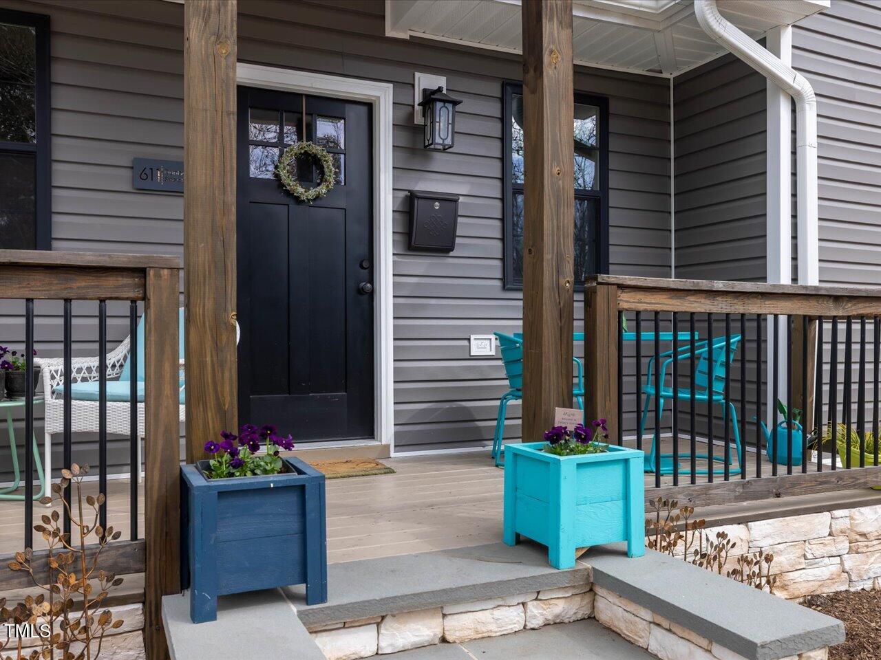 611 Dunbar Street Durham, NC 27701 - Photo 2 of 28 a view of a house with a potted plant and a window