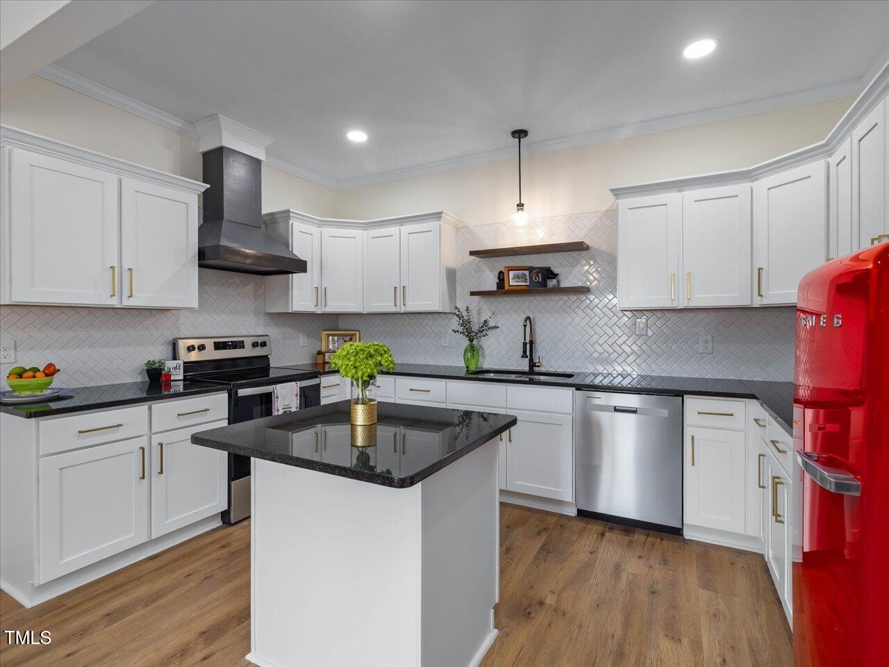 611 Dunbar Street Durham, NC 27701 - Photo 3 of 28 a kitchen with granite countertop a sink dishwasher a stove and a refrigerator