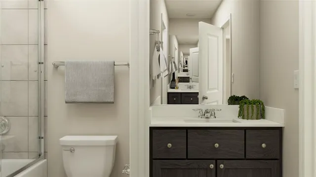 a bedroom with a bed and a potted plant