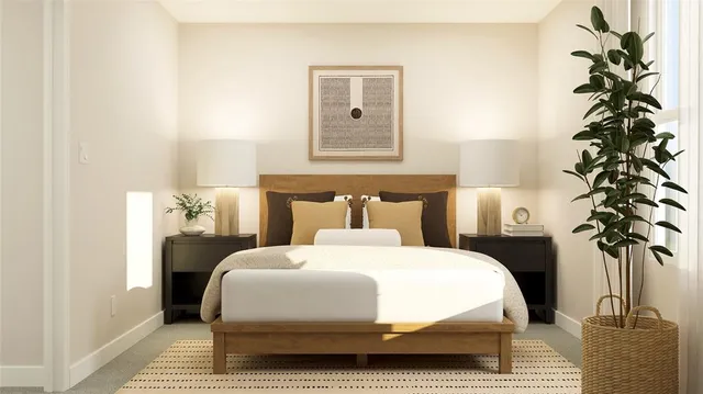 a bedroom with furniture and a potted plant