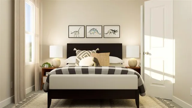 a bedroom with a large bed and a dresser