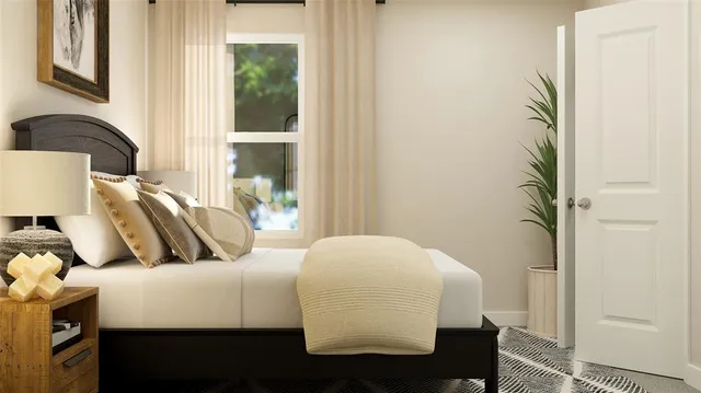 a living room with furniture and a floor to ceiling window