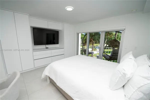 a bed room with a bed and a night stand