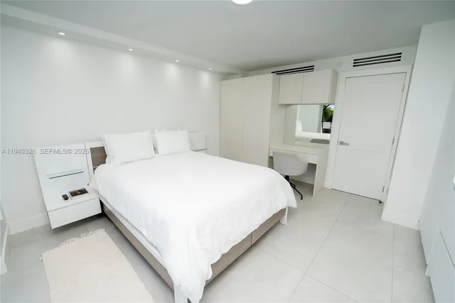 a bathroom with a sink a mirror a toilet and shower