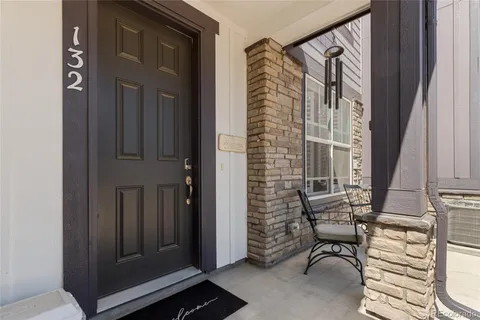 a view of front door with furniture and staircase