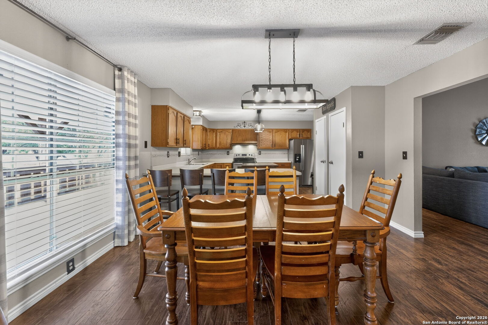 5 Cedar Ridge Road Boerne, TX 78006 - Photo 15 of 47 a view of a dining room with furniture wooden floor and chandelier