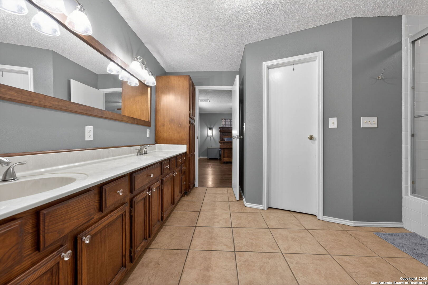 5 Cedar Ridge Road Boerne, TX 78006 - Photo 22 of 47 a large bathroom with a double vanity sink and a mirror