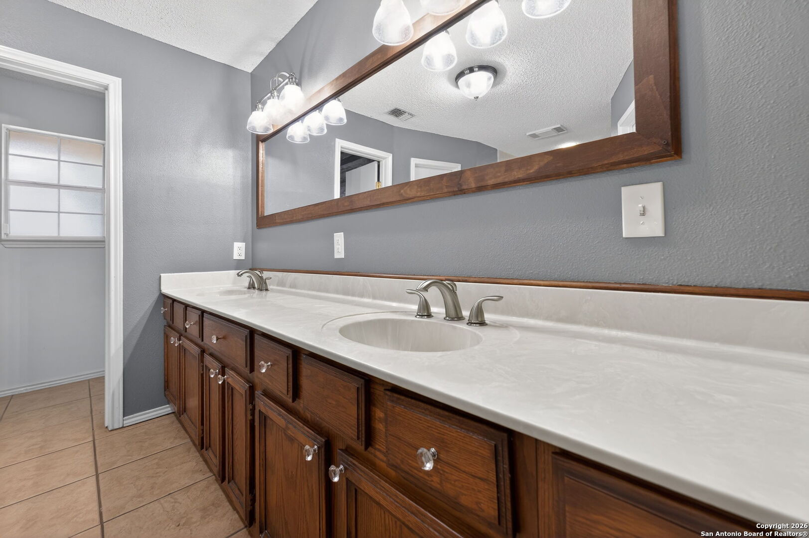 5 Cedar Ridge Road Boerne, TX 78006 - Photo 25 of 47 a bathroom with a sink double vanity and a mirror