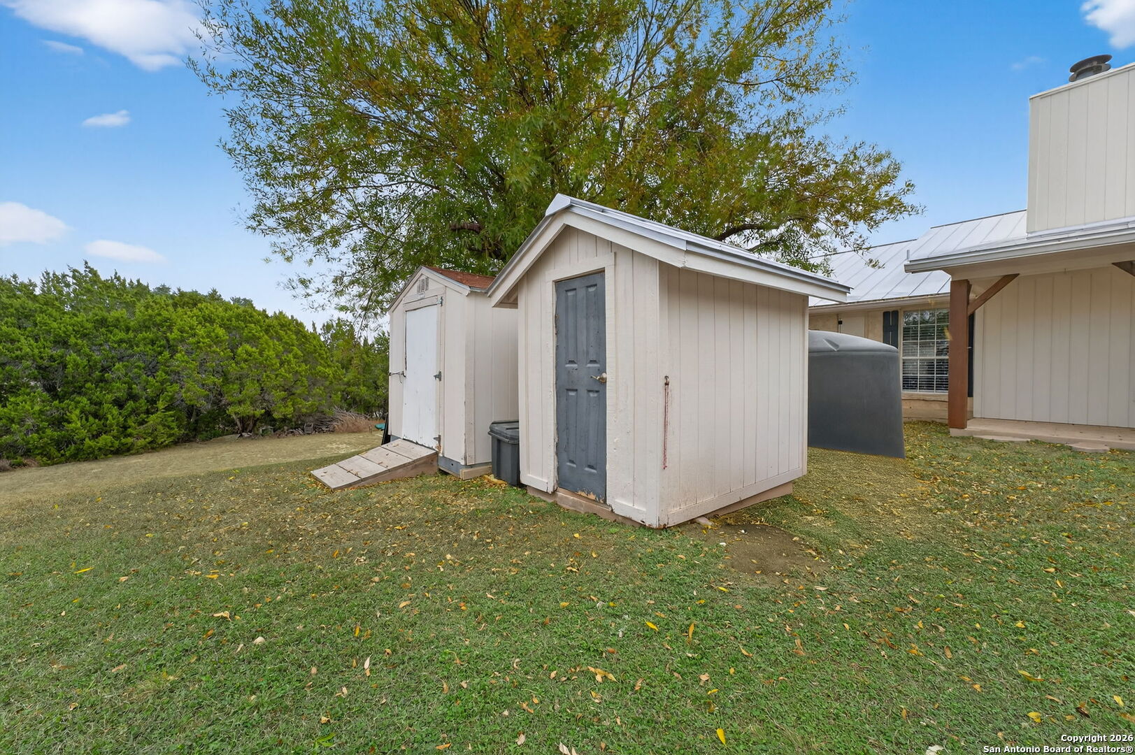 5 Cedar Ridge Road Boerne, TX 78006 - Photo 38 of 47 a view of a house with a yard and garage